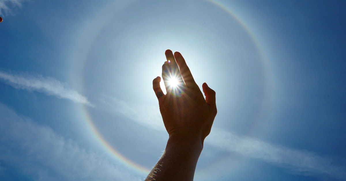 A persons hand raised to God