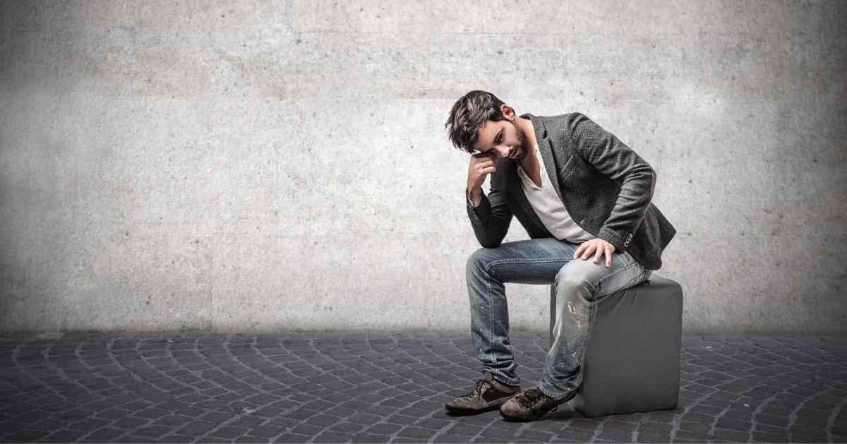 a guy sitting alone in a room