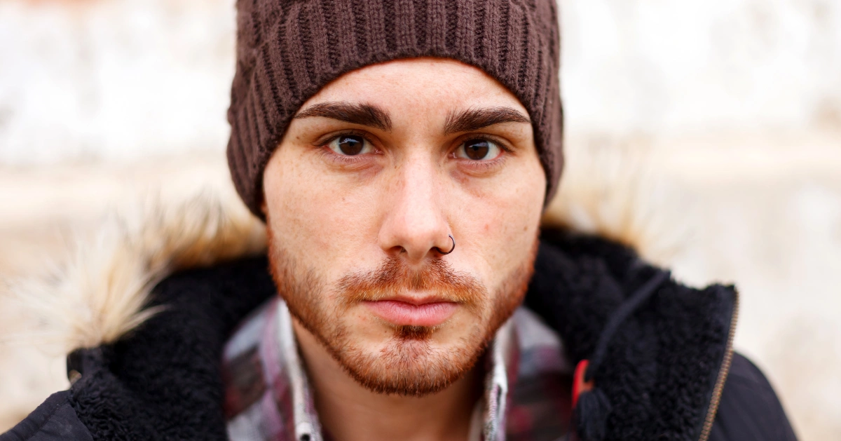 a guy looking at the camera sad
