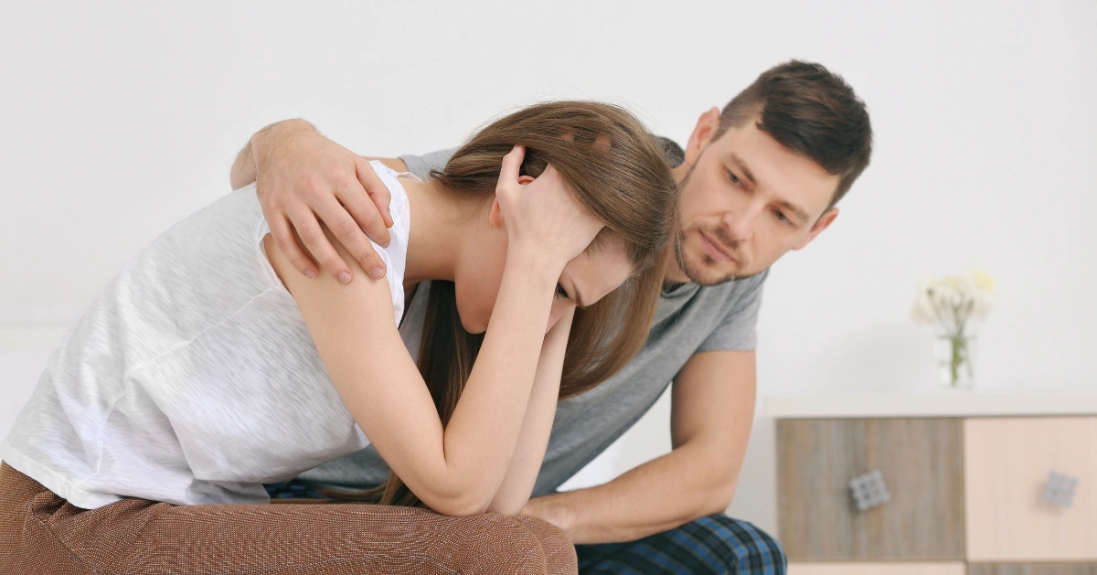 boyfriend comforting his girlfriend