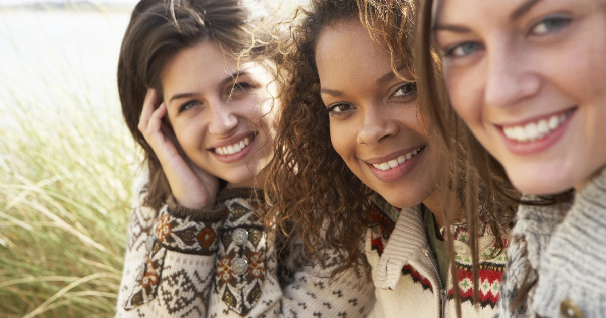 three woman smiling to the camera