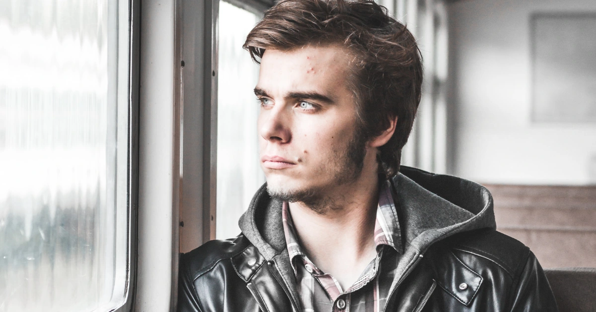 Guy looking out the window