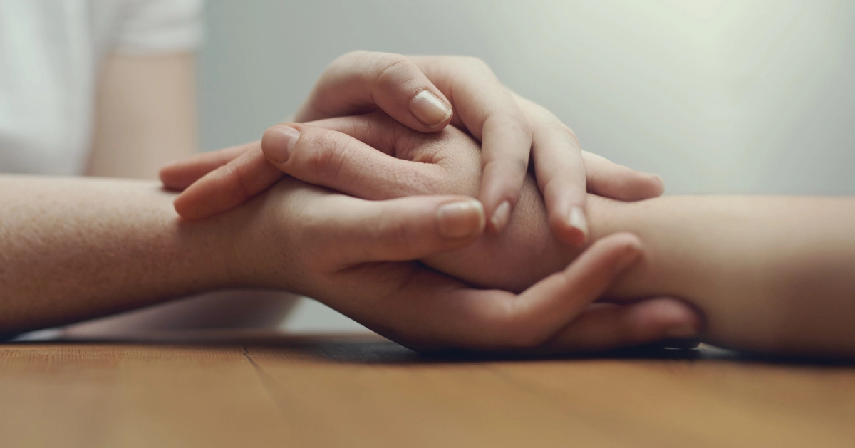 hands holding for support