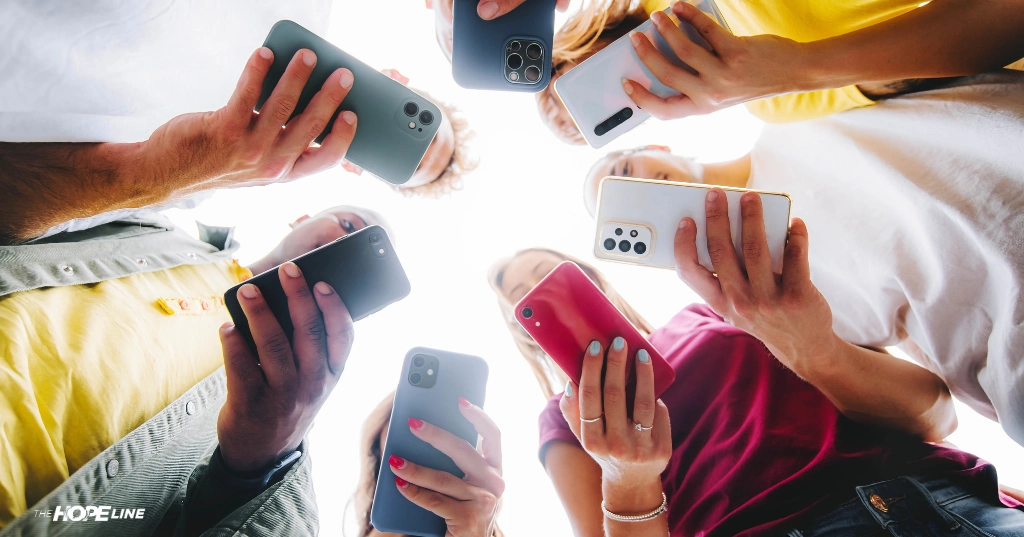 young adults on their phones not connecting with each other